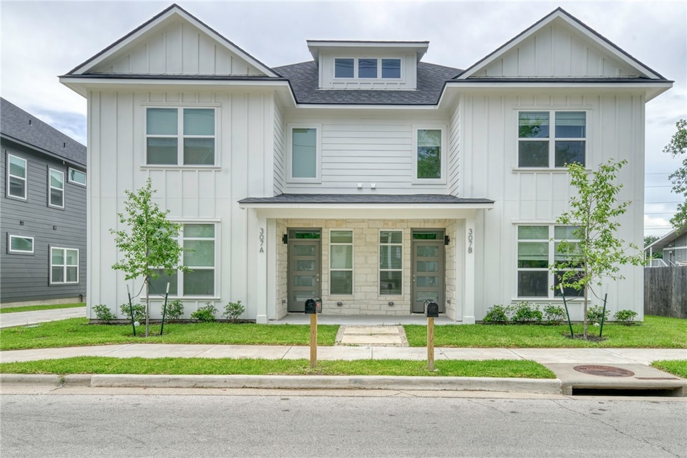 Modern farmhouse with board and batten siding, a s