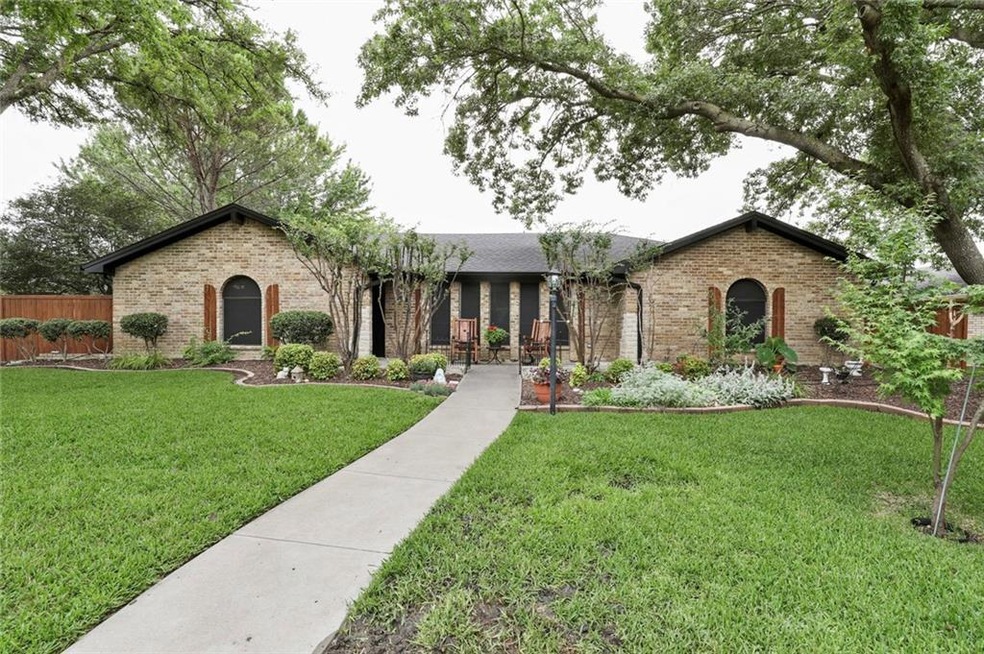 Stunning curb appeal with inviting manicured lawn.