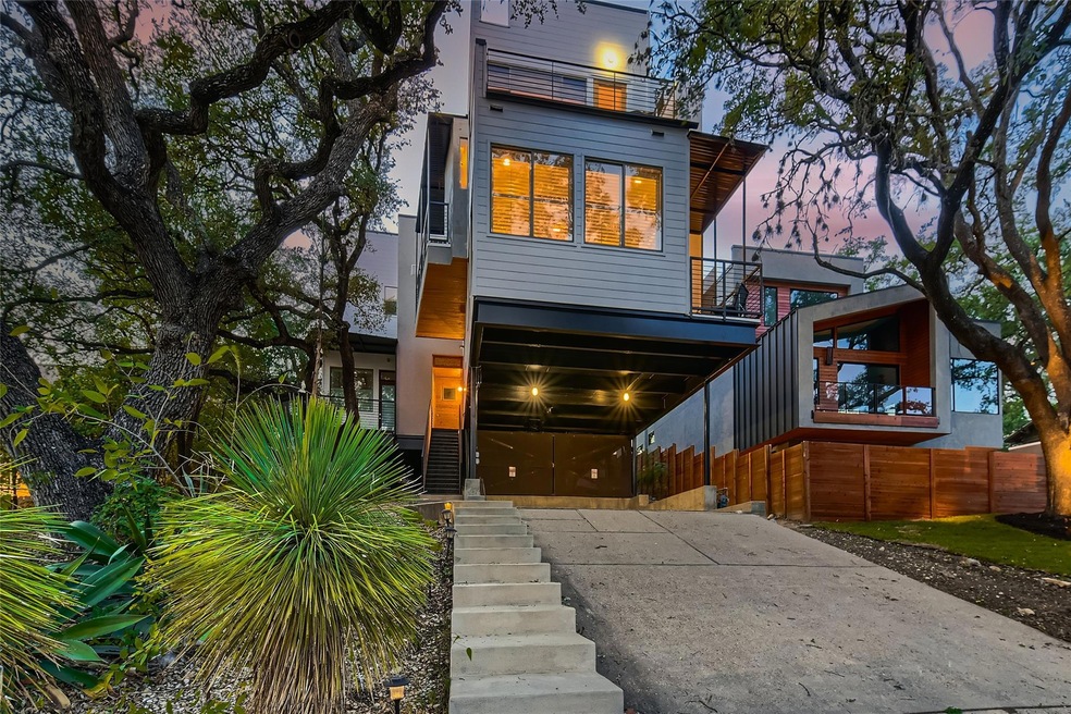 Contemporary home with stairway, a balcony, and c