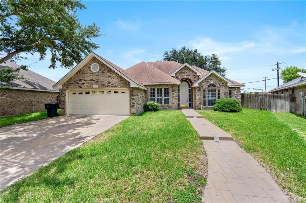 Single story home featuring a garage, concrete driveway, brick siding, and roof with shingles
