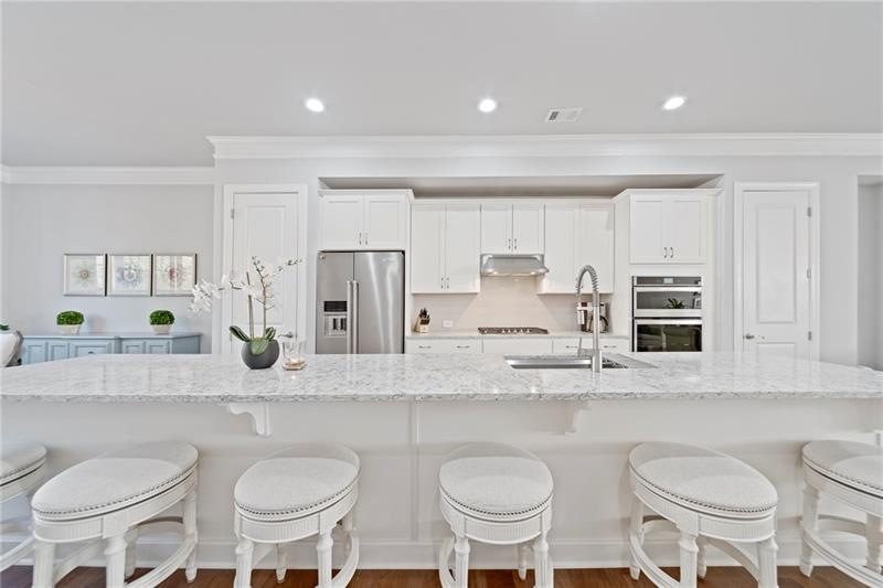 Huge kitchen island is the centerpiece of the kitc