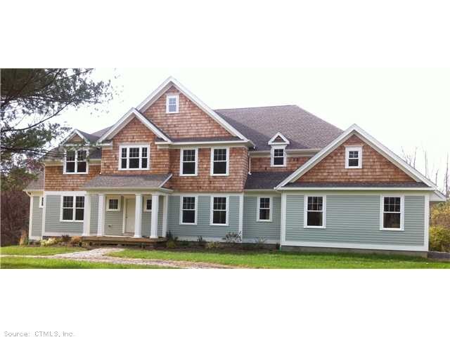 Front elevation featuring a combination of clapboa