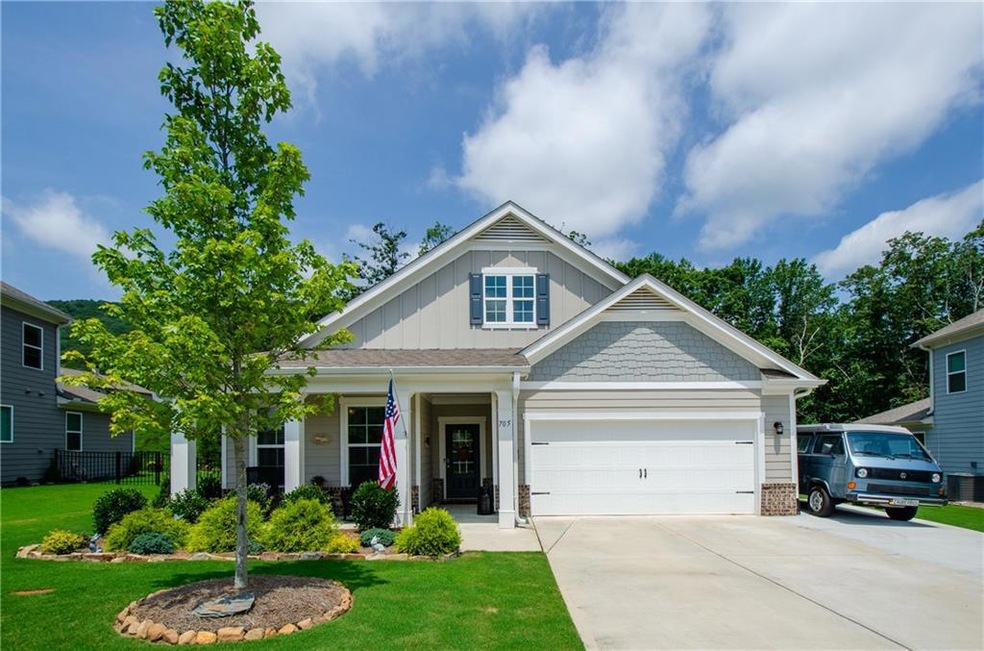 View of front of home featuring a garage and a fro