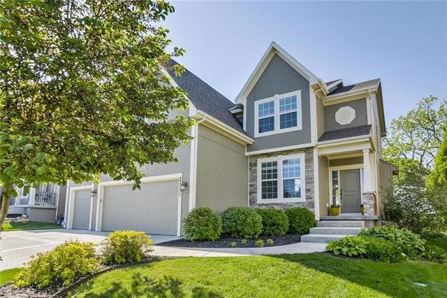 Beautiful stucco and stone front with 3 car garage