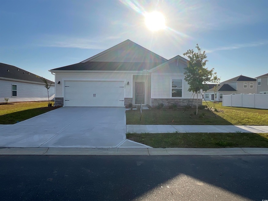 View of front of property featuring stone siding, 