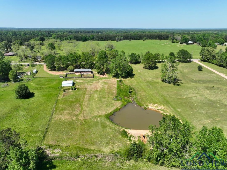 Aerial view featuring a rural view and a water vie
