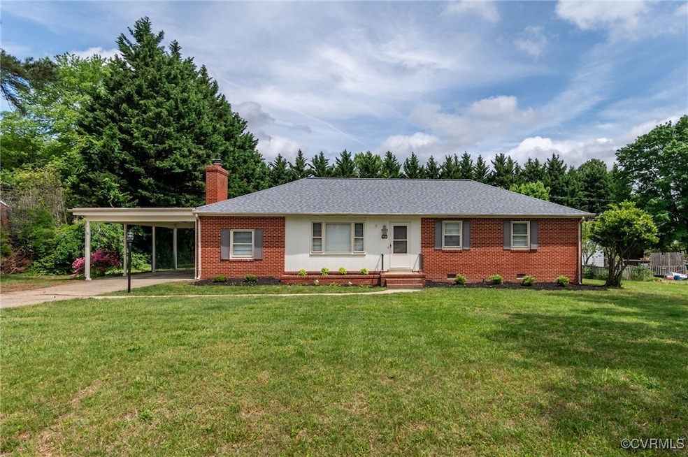 Front view of the house and carport