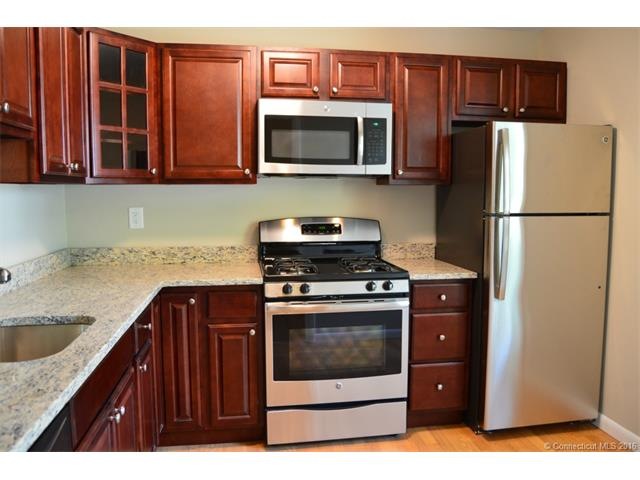 This kitchen has tons of upper and lower cabinets 