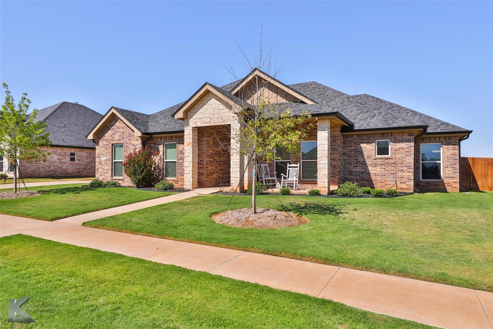 View of front of house featuring a front yard wher
