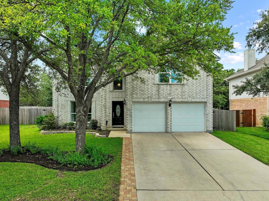 View of front of property with brick siding, conc