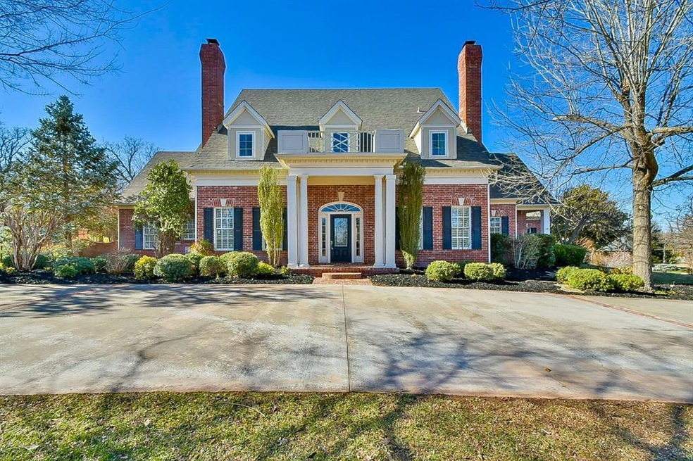 Greek revival inspired property with brick siding,