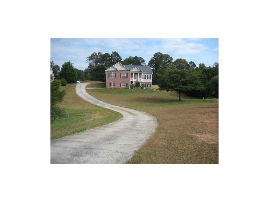 Exterior Front. Long, winding drive to home that s