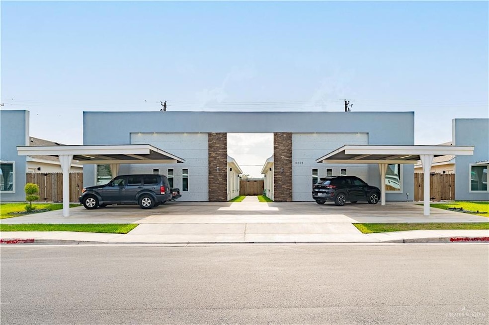 View of property with covered parking