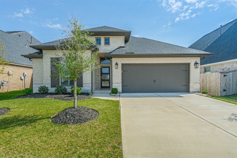 Welcome home to 28707 Bella Leigh Court in a private gated community within Firethorne!
