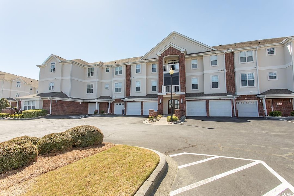 Multi unit property featuring driveway, brick sidi
