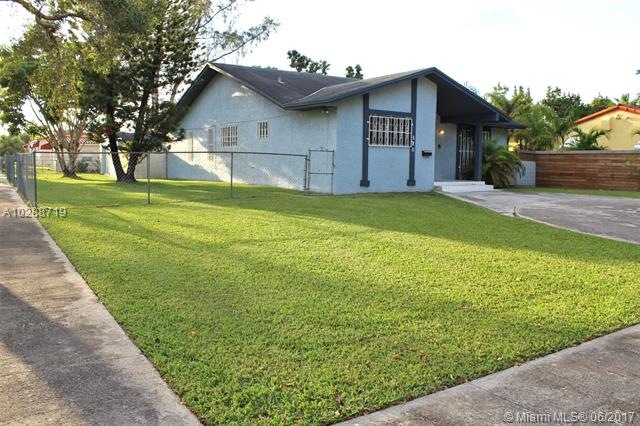 Large corner lot with circular driveway.