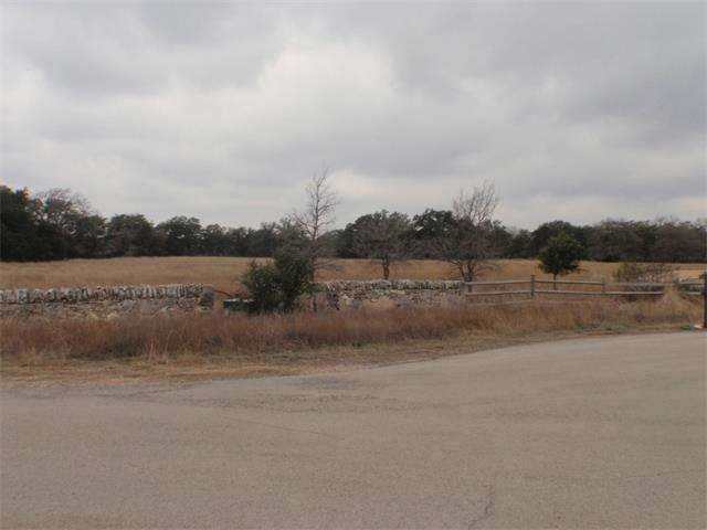 Though this lot is treeless, it is surrounded on t