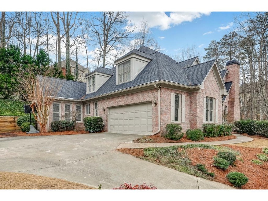Brick beauty with side entry garage.