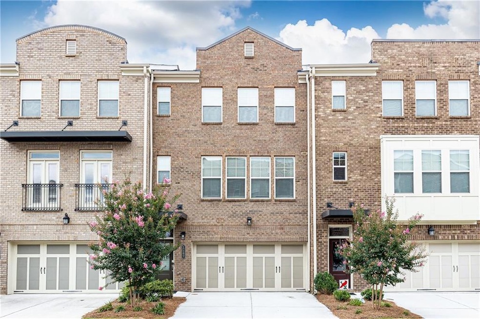 3 level townhome featuring a 2 car garage
