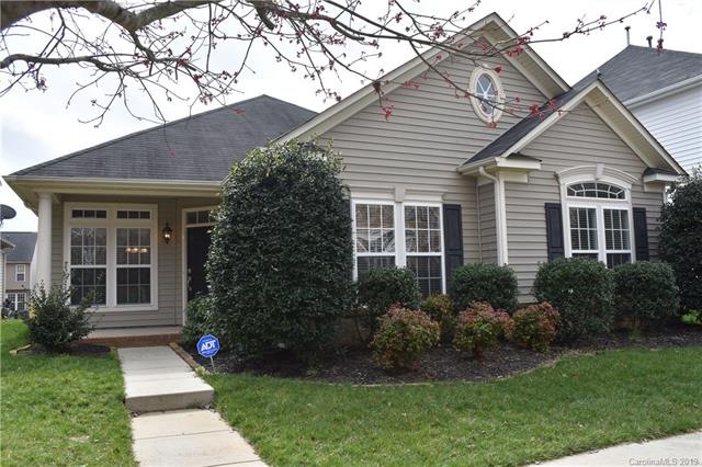 Fabulous 1.5 story home located in Gilead Ridge neighborhood in Huntersville, NC! Nice view of front showing the covered front porch and landscaping.