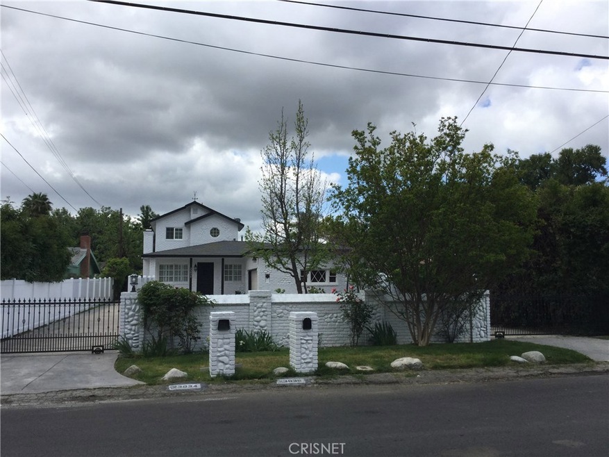 Gated entrance with circular driveway