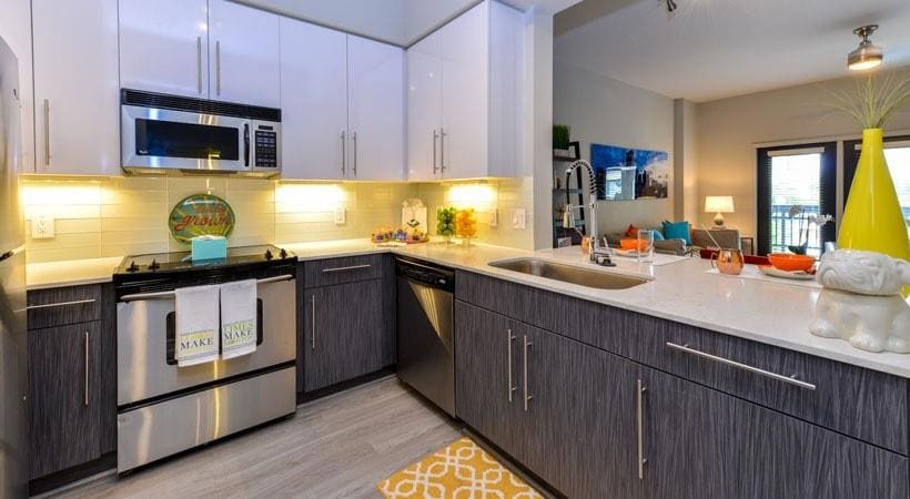 Kitchen with light hardwood / wood-style floors, t