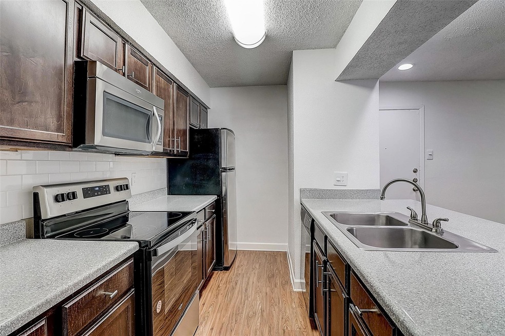 Kitchen featuring sink, stainless steel appliances