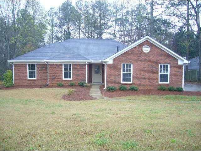 Exterior Front. Three bedroom brick ranch