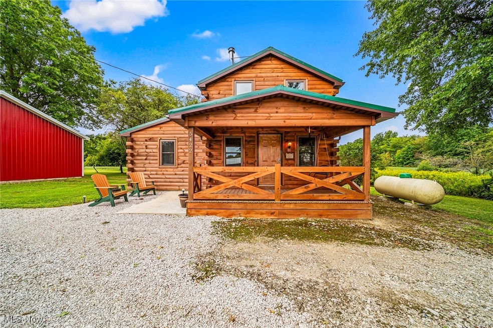 View of front facade featuring log exterior