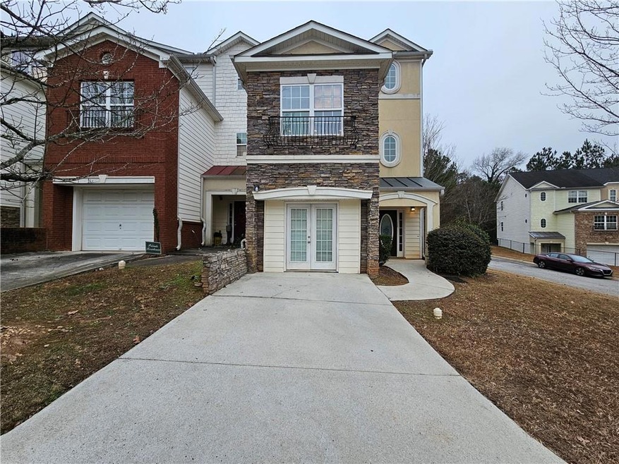 View of front of house featuring french doors, a s