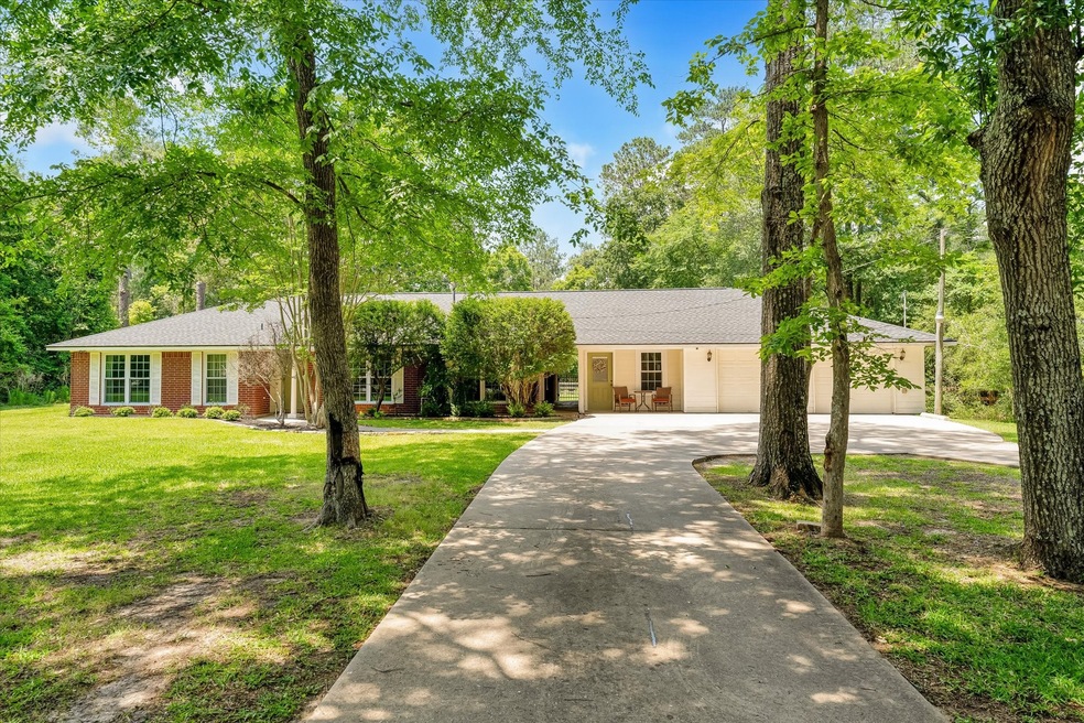 Welcome to 25407 Pipestem Drive in Clear Creek Forest!