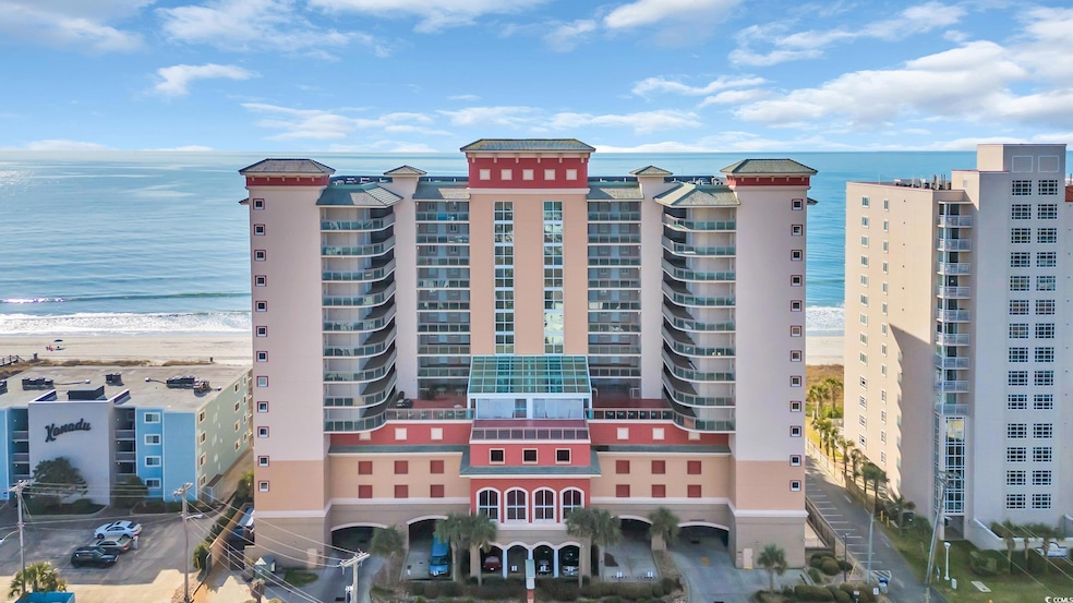 View of building exterior with a water view and a 