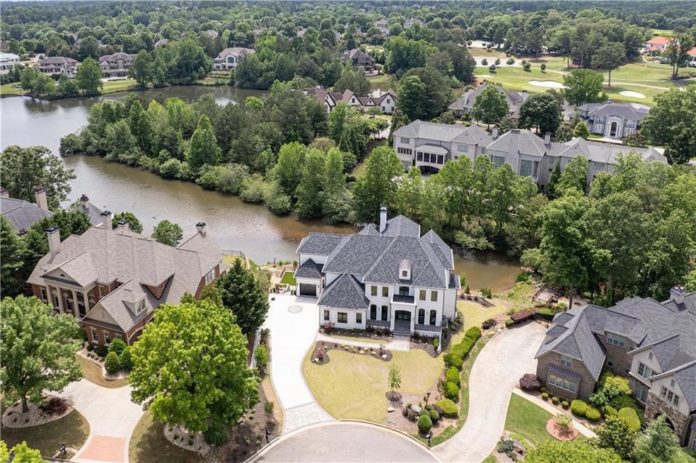 Stunning white brick home on premium lake lot in p