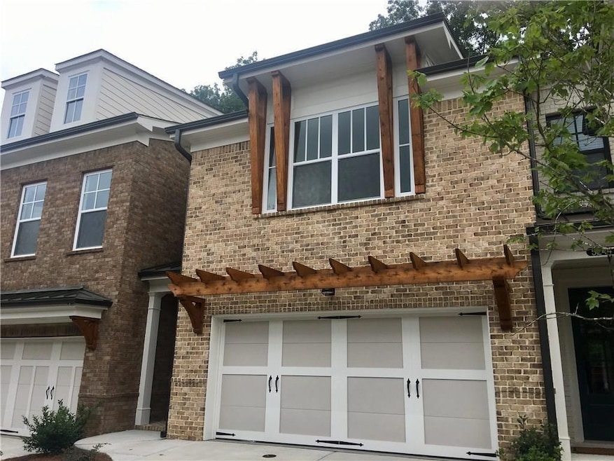 View of property exterior with a garage, concrete 