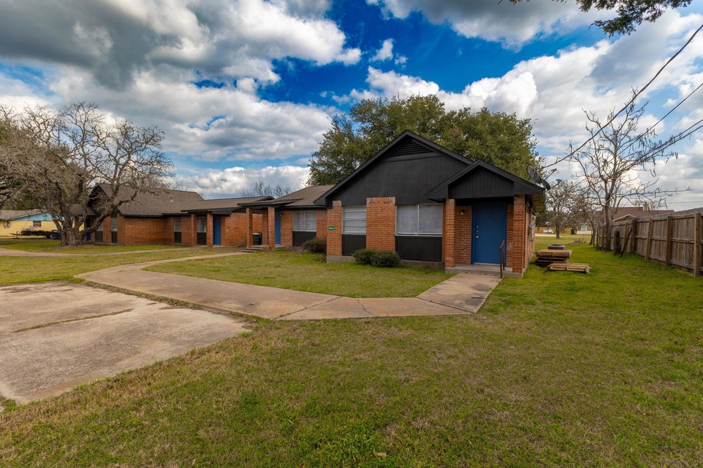 View of front of house featuring brick siding, a 