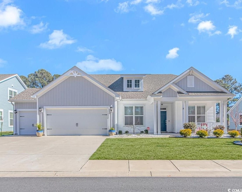 View of front facade featuring an attached garage,