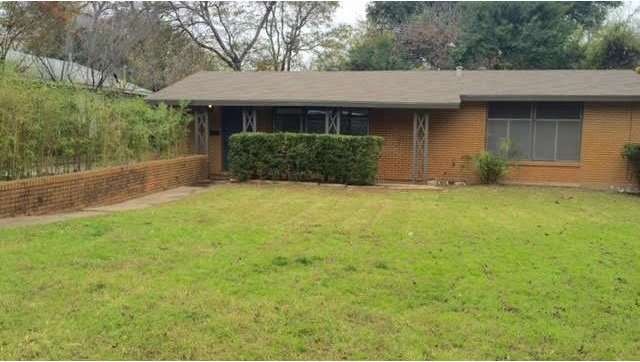 Superb mid-century clean lines and brick home. Dee
