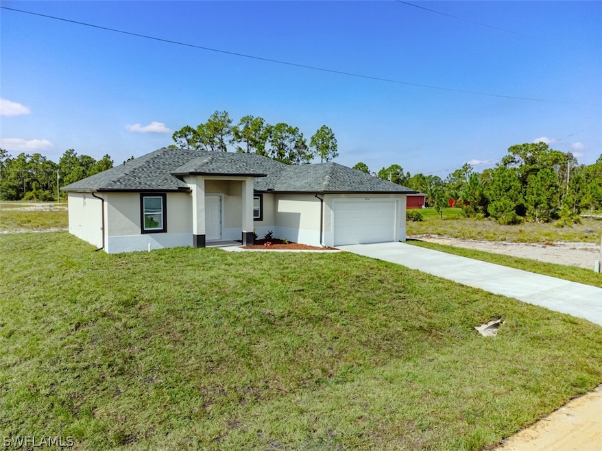 View of front of property featuring a garage and a