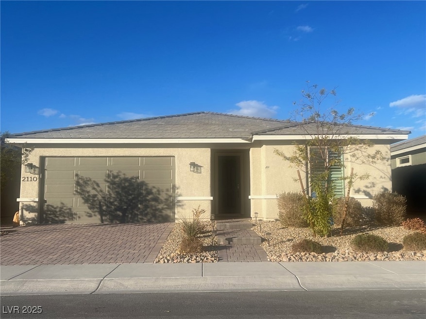 Ranch-style home featuring stucco siding, decorati