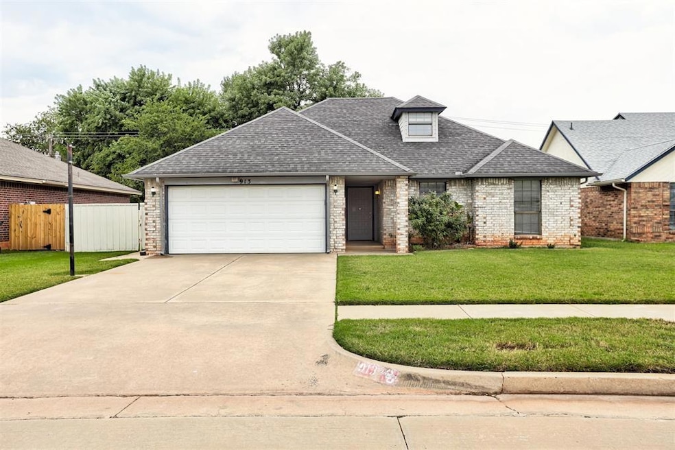 View of front of property with roof with shingles, brick siding, concrete driveway, and an attached garage