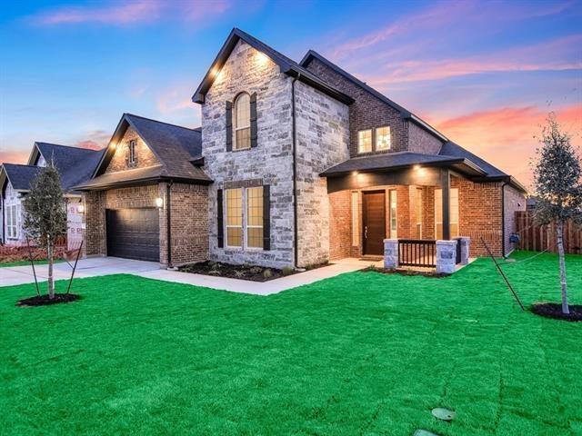 Beautifully finished with limestone and brick exterior, these earth tones compliment the surroundings and offer fantastic curb appeal.