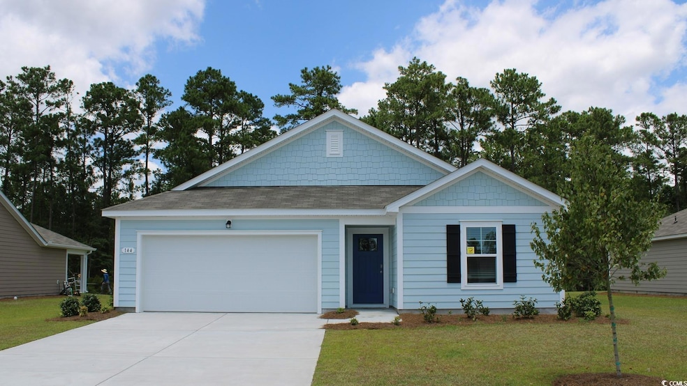 View of front of property featuring roof with shin