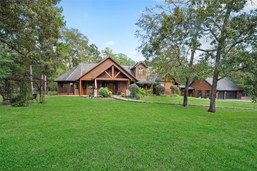 Welcome to this beautiful log home, where rustic charm and natural beauty come together. Nestled in the towering trees it is surrounded by nature. This log home offers a peaceful haven for those seeking an escape from the hustle and bustle of everyday life. (Grass has been photo enhanced) Click link for video tour.
