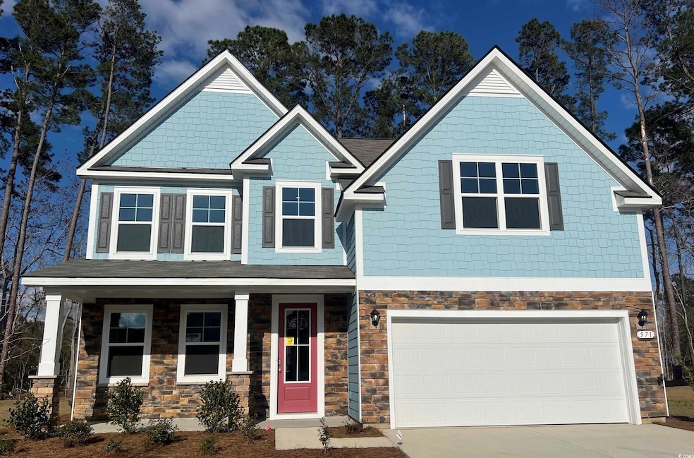 Craftsman-style house featuring stone siding, cove