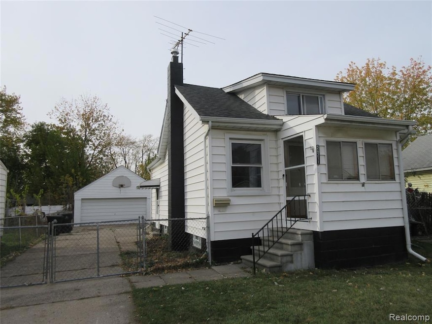 Bungalow with a gate, an outdoor structure, a chimney, a garage, and a shingled roof