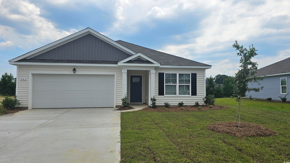 View of front facade featuring a garage and a fron