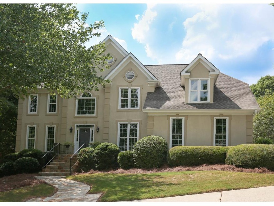 Traditional hardcoat stucco home with circular dri