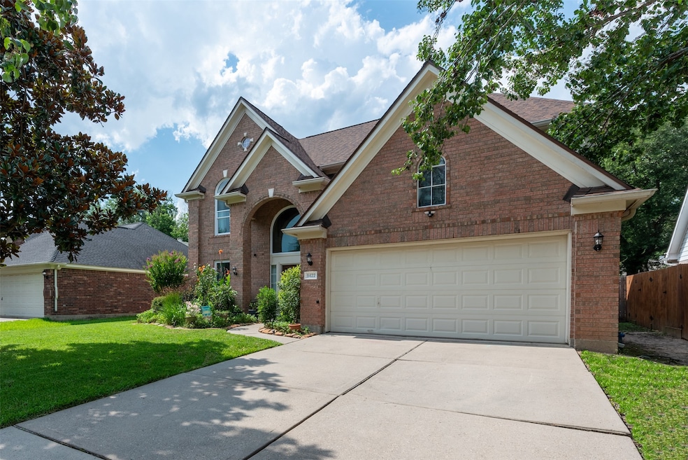 Charming brick home with a two-car garage and a ma