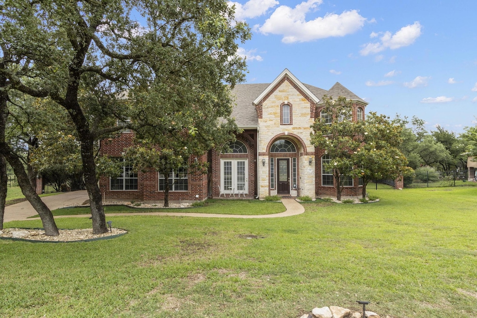 View of front facade with a front lawn, brick sid