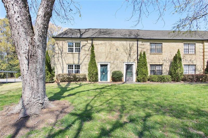 Front of 390A. Pretty brick front with lush settin